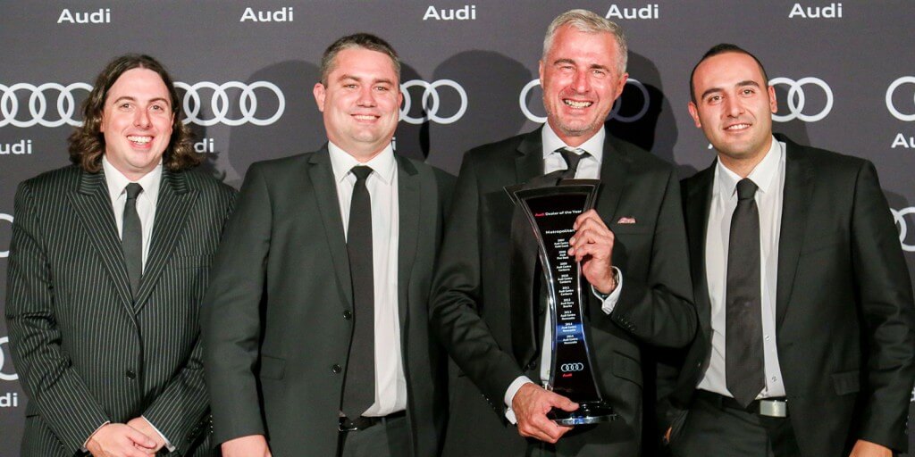 Audi Centre Newcastle team with DP Wayne Sanders holding the trophy